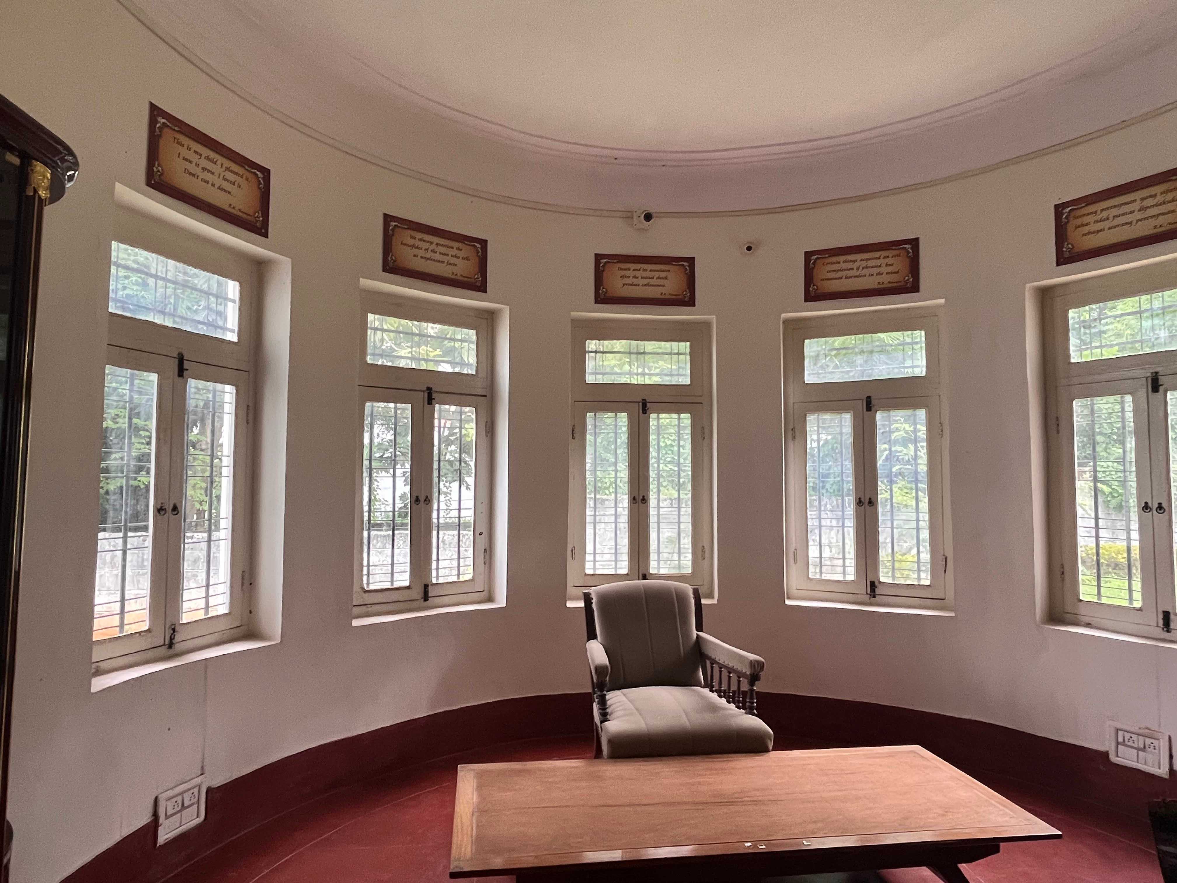 <b>This room with windows across the wall is one of the most striking ones in the RK Narayan Museum, looking out at the greenery outside. His study above has a similar design with eight bay windows.</b>