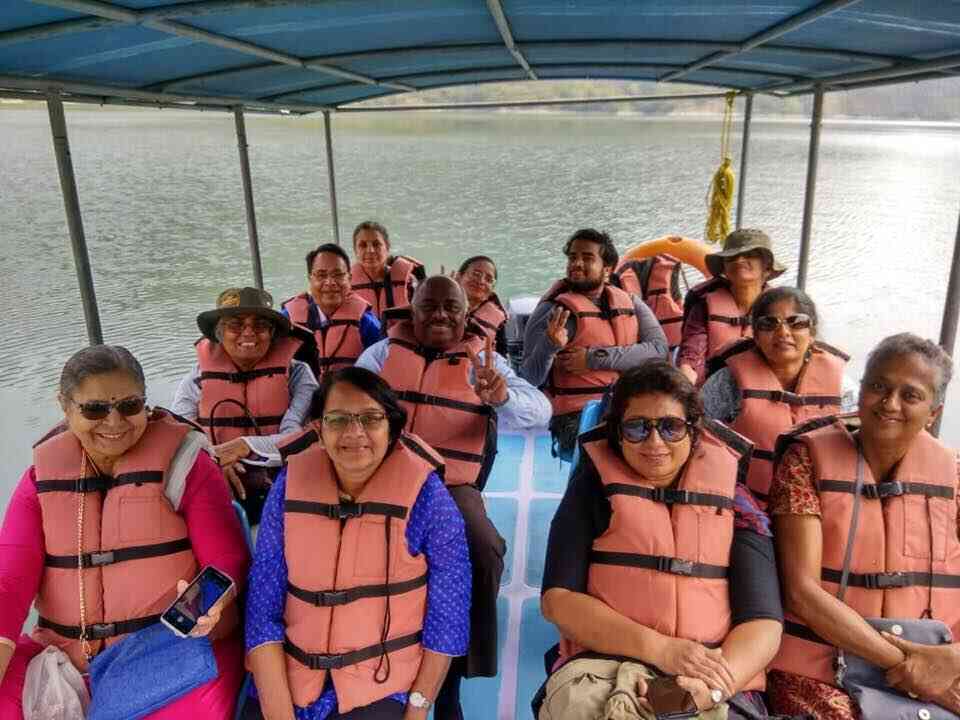 <b>Vimala (seated second from left in the first row) on holiday with a travel group</b>