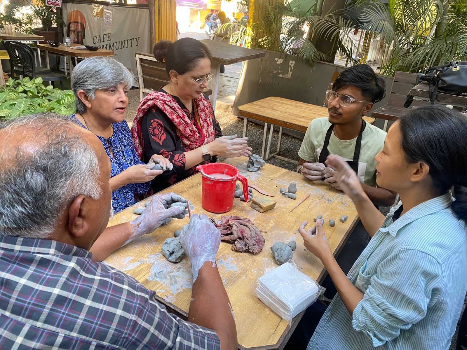 Members enjoying a bonding experience while moulding clay