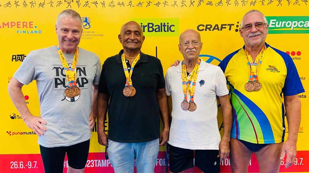 <b><i>Kurian Jacob (in black shirt) and Sebastian Kadalikattil (in white). Since there were only two of us from India and the relay team needed four members, I invited John Morris from Australia and Ian Robertson from Canada to form relay teams and we won two bronze medals in Tampere, says Kurian.</i></b>